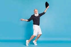 Full length body size sie profile photo man dancing with black hat isolated pastel blue color background
