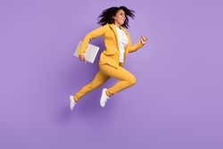 Photo of pretty charming woman dressed suit spectacles holding device jumping running isolated violet color background