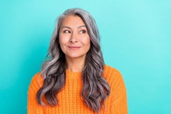 Portrait of attractive cheerful curious grey-haired woman thinking guessing isolated over bright teal turquoise color background