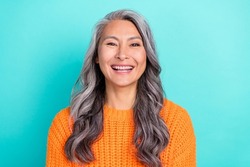 Portrait of attractive cheerful glad grey-haired woman laughing funny joke isolated over bright teal turquoise color background