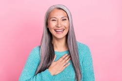 Photo of funky excited mature woman laughing enjoying moment hear good joke isolated on pink color background