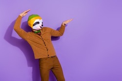 Photo of young guy dance unusual outfit clubber look empty space isolated over violet color background