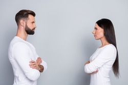 Photo of attractive confident sister brother wear white shirts hands crossed looking each other isolated grey color background