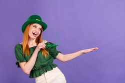Photo of pretty adorable young lady wear green blouse cap celebrating st patrick day dancing smiling isolated purple color background