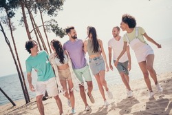 Photo of six people group gathering cuddle walk funny laugh enjoy talk wear casual outfit nature seaside beach