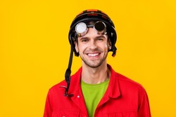 Portrait of attractive cheerful funny guy wearing vintage helm specs isolated over bright yellow color background