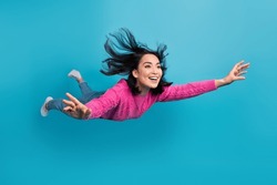 Full length photo of adorable pretty lady wear pink pullover falling air isolated blue color background