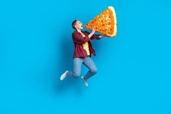 Full body size photo cadre of funny student girl blonde short hair hold huge piece pizza overeating hungry person isolated on blue color background