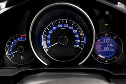Close up shot of a speedometer in a compact car 