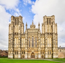 The West Front of Wells Cathedral and Cathedral Green, Wells, Somerset, England, UK. Wells Cathedral is considered to be one of the most beautiful cathedrals in England.