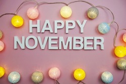 Happy November alphabet letters on pink background