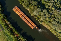 barge tug transporting commodity along the river - Tiete-Parana Waterway