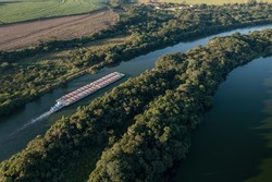 grain transport barge going up the tiete river - tiete-parana waterway