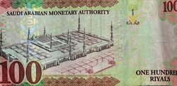 Saudi Arabia 100 riyals banknote, The Saudi riyal is the currency of Saudi Arabia, Saudi kingdom one hundred riyals  with the photo of king Salman Bin Abdulaziz and Madinah mosque (reverse side) 