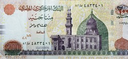 A fragment of the obverse side of 200 Egyptian pounds banknote year 2013, observe side has an image of Mosque of Qani-Bay Cairo, Egypt. The reverse side has an image of The Seated Scribe