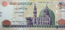 A fragment of the obverse side of 200 Egyptian pounds banknote year 2014, obverse side has an image of Mosque of Qani-Bay Cairo, Egypt. The reverse side has an image of The Seated Scribe