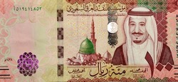 Large fragment of the obverse side of 100 one hundred Saudi riyals banknote features prophet's mosque in Medina  and portrait of king Salman Bin AbdelAziz Al Saud series 1438 AH, Saudi Arabia currency