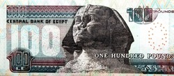 Large fragment of the reverse side of 100 LE one hundred Egyptian pounds bill banknote series 2013 features Sphinx of Giza, selective focus of Egyptian cash money