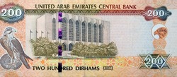 Large fragment of reverse side of 200 AED two hundred Dirhams banknote of United Arab Emirates that features the imagery of the Central Bank of the UAE and a falcon image, Emirates money banknote