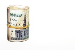 Egypt money roll pounds isolated on white background, 200 LE two hundred Egyptian pounds cash money bills rolled up with rubber bands with a image of Qani Bay mosque on the banknote, selective focus