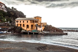 Seascape view of Mediterranean beach near five towns and port Madona during a cloudy winter day, Levanto, La Spezia, Italy