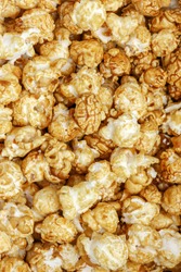Popcorn Pattern. A pile of popcorn. Sweets. Popcorn Pattern. Caramel popcorn textured background. Food, cinema, movie. Top view. 