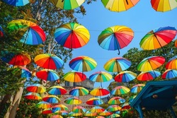 Background of colorful rainbow umbrella street decoration