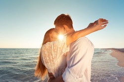 Romantic couple kissing on the beach