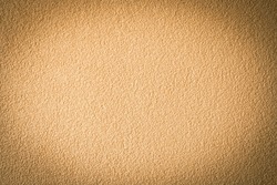 Abstract vignetting brown beige plastered wall background.