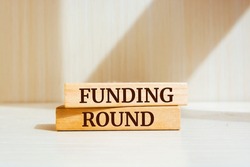 Wooden blocks with words 'Funding round'. Business concept