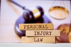 Wooden blocks with words 'Personal Injury Law'. Legal concept
