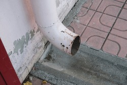 old rusted broken crushed water drain pipe. rainwater drain pipe.