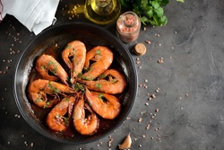 Roasted (fried) big shrimps in tomato sauce with olive oil, garlic, cilantro and soy sauce...