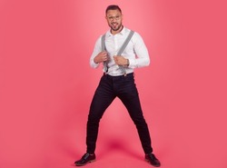 Male positive emotions. Portrait of funny funky crazy man with suspenders. Crazy freak guy.