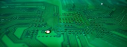 Electronic circuit board technology background. Electronic plate pattern. Circuit board, electrical scheme. Technology background. Electronic microcircuit with microchips and capacitors taken.
