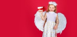 Angel child banner, isolated studio background. Angel children girl with white wings Cute baby child with angel wings. Angel kids with present gift, studio portrait.