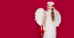 Valentines day banner with angel child. Kid girl angel with present gift, studio portrait. Little angel with white wings holds gift. Playful angelic little girl. Valentines day.