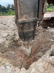 The wire is connected to a concrete pile where a hydraulic hammer is ready to hammer the pile in the PDA test. Pile Driving Analyzer is based on the theory of Stress Wave Propagation on Piles.