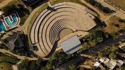 Empty concrete amphitheater with Stage. Aerial top down view. Villa Maria in Cordoba, Argentina, South America