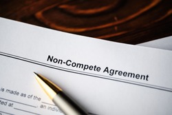 Legal document Non-Compete Agreement on paper close up.