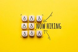 Concept is now hiring. Abstract staff icons on dice