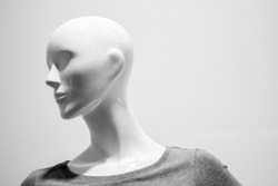 Close-up of a plastic mannequin head. Black and white