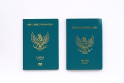 Indonesian electronic passport and regular passport isolated on white background