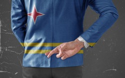 Jacket Flag of Aruba on Businessman with his fingers crossed behind his back 
