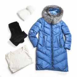 flat lay from female fashion winter outerwear for cold weather in winter season. Set winter women clothes isolated. Jacket, hat, trousers, jumper