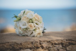 wedding bouquet on stone surface
