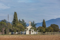 old small church and cemetary in italian countryside