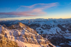 Santis peak mountain Switzerland. spectacular view, sunset. winter snow covered mountains . High quality photo