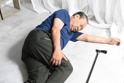 Asian elderly man who fell and injured his leg
