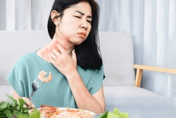 Asian woman have allergy reactions to shrimp or seafood have problems with rash, itching, and hives on the skin